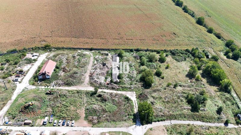 A rural area near Levice with agricultural and forest lands, surrounded by fields and roads.