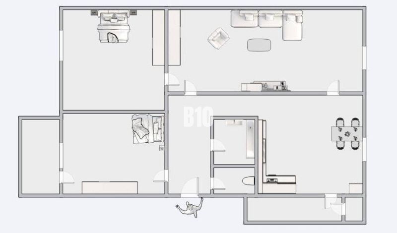 Floor plan of a 3-room apartment with a living room, kitchen, and bedrooms.