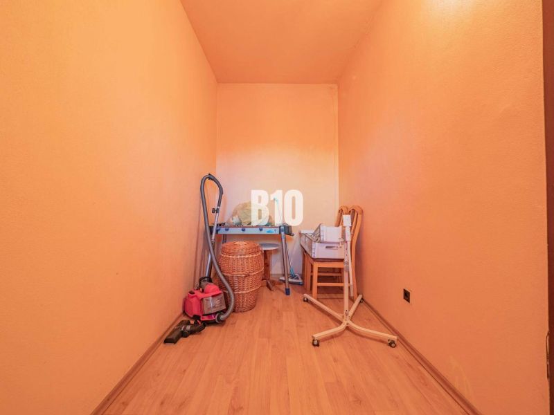 Storage space in a 3-room apartment with a wooden decor floor.