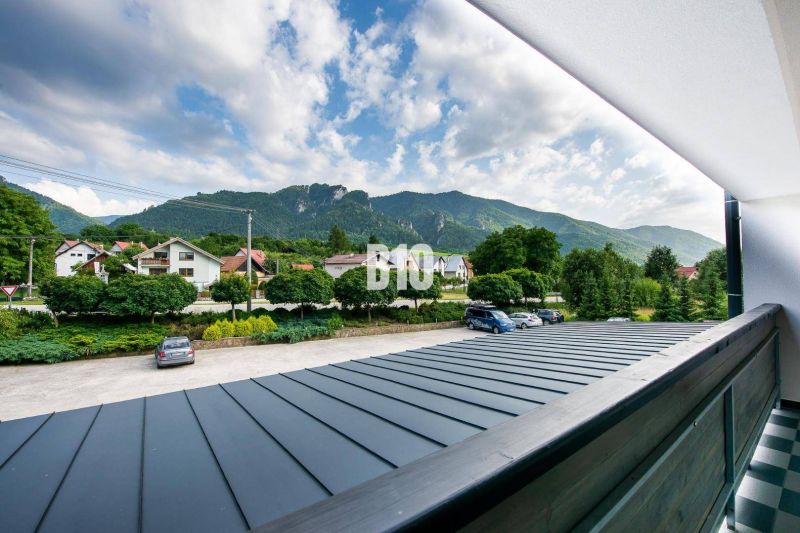 View from the balcony in Terchová of the mountains and houses, a space suitable for a studio apartment.