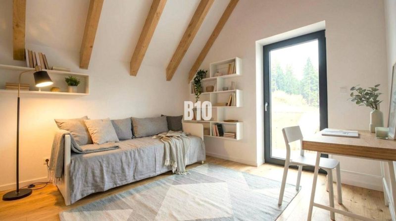 A bright room in a cabin with wooden beams, a couch, and a table on a floor with wooden decor.