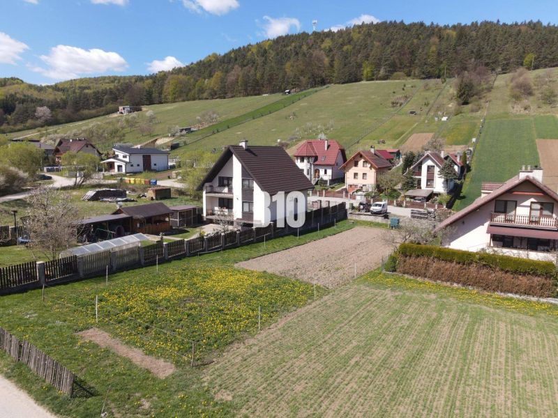 Hilly terrain with houses and gardens in Bytča on Pozemky - housing.