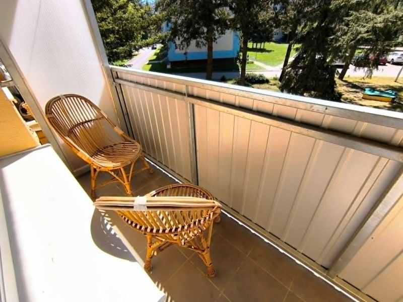 The balcony of a 1-room apartment on Malá Okružná in Partizánske with rattan seating.