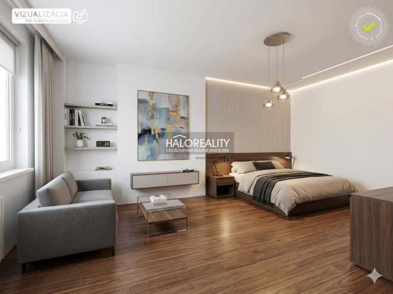 Bedroom in a studio apartment with a bed and a sofa, wooden decor flooring.