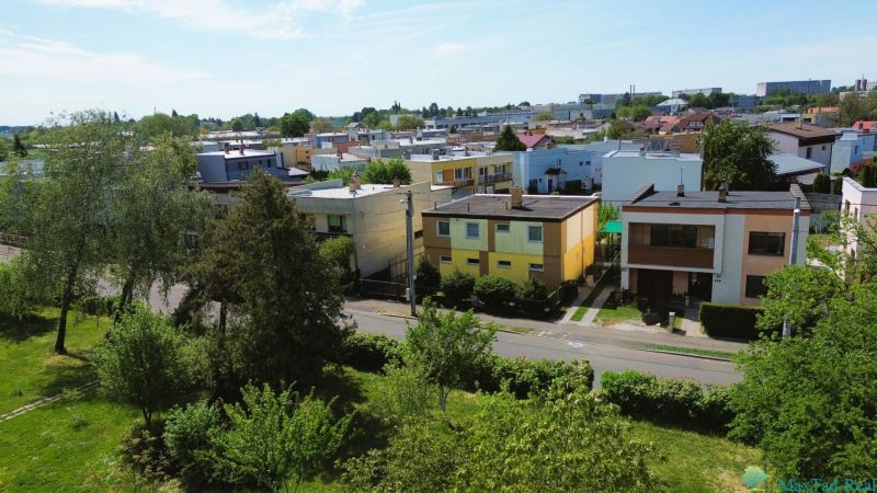 A view of family houses on Nabr. J. M. Hurbana in Michalovce surrounded by greenery.