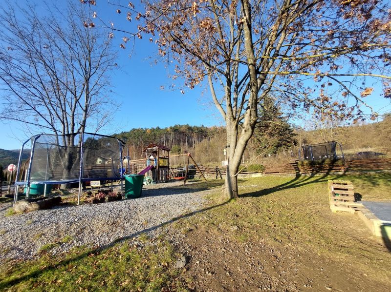 Playground with a trampoline and trees at L. Svoboda Square in Banská Bystrica.