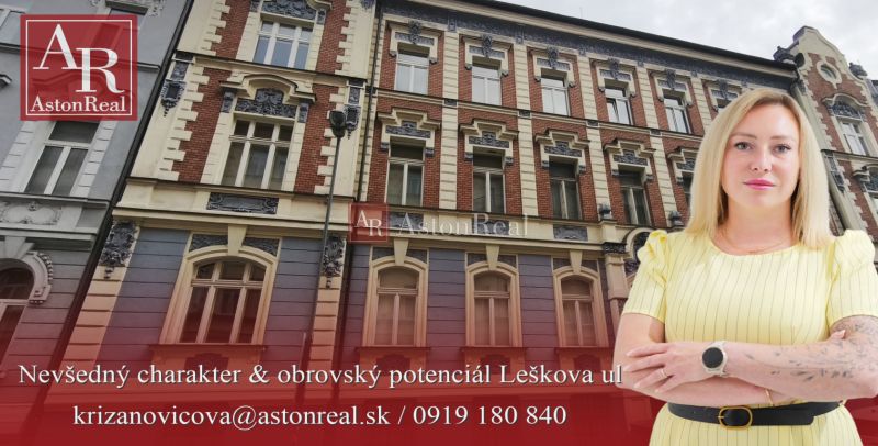 A historic building on Leškova Street in Bratislava with an advertisement for a real estate agency.