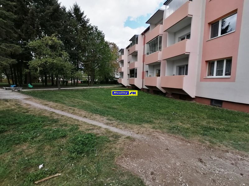 An apartment building on Záborského Street in Martin surrounded by greenery and sidewalks.