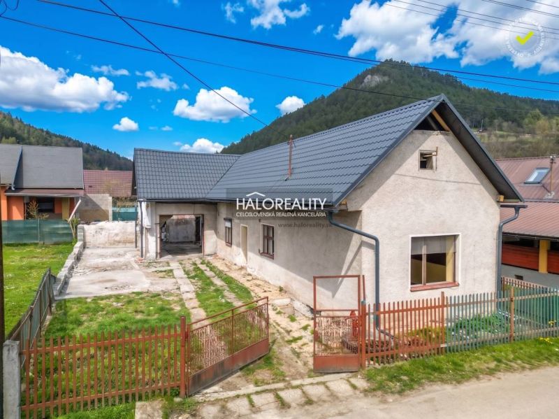 A family house in Stupno with a courtyard, garden, and surrounding hills.