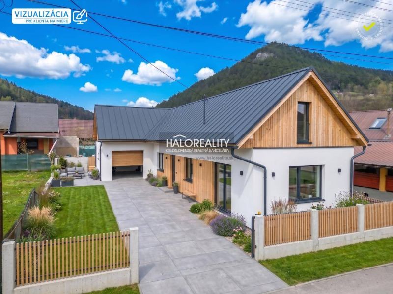 A family house in Stupno with a garage, a well-maintained garden, and wooden cladding on the facade.