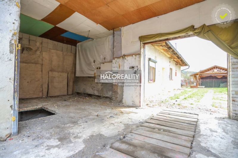 A view of the garage in a family house in Stupno with a makeshift wooden floor.