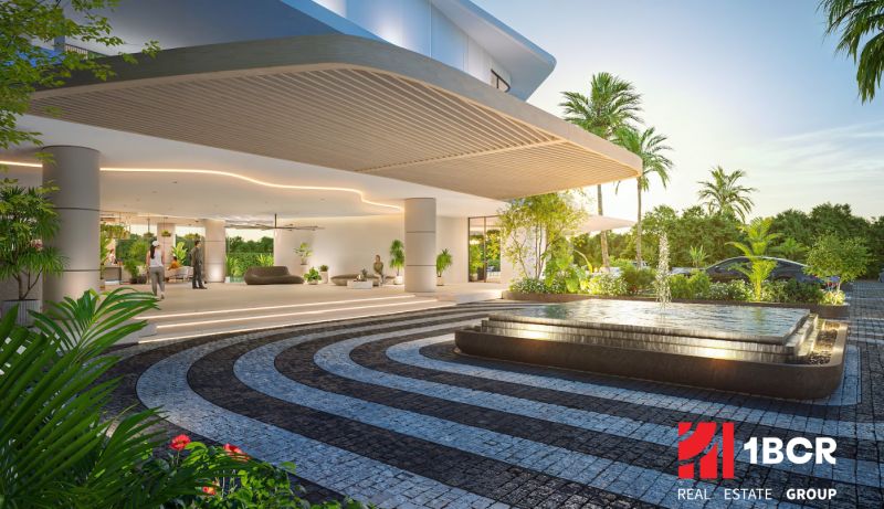 Architectural entrance with a garden and fountain. The apartment development in Phuket offers a luxurious environment.