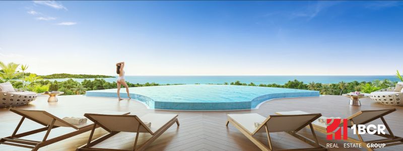 A pool with a sea view and sun loungers, Apartment construction in Phuket.