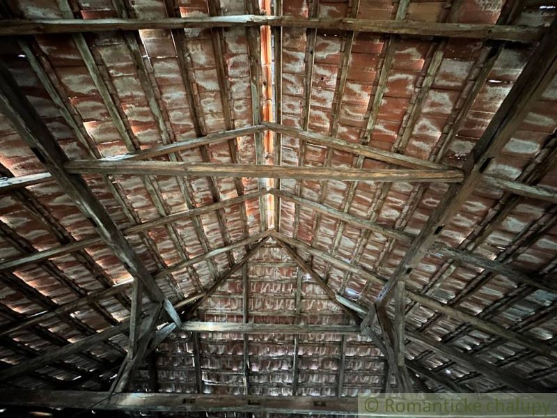 A view of the attic with an old roof structure in a family house.