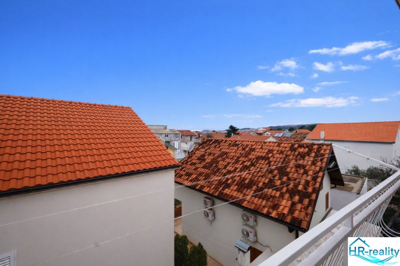 A view of rooftops and the blue sky from a holiday apartment in Vodice.