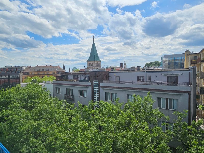 A view of historical architecture and greenery from Poštová Street in Bratislava - Old Town.