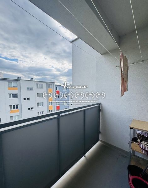 The balcony of a 3-room apartment on Za poštou Street in Hlohovec with a view of the housing estate.