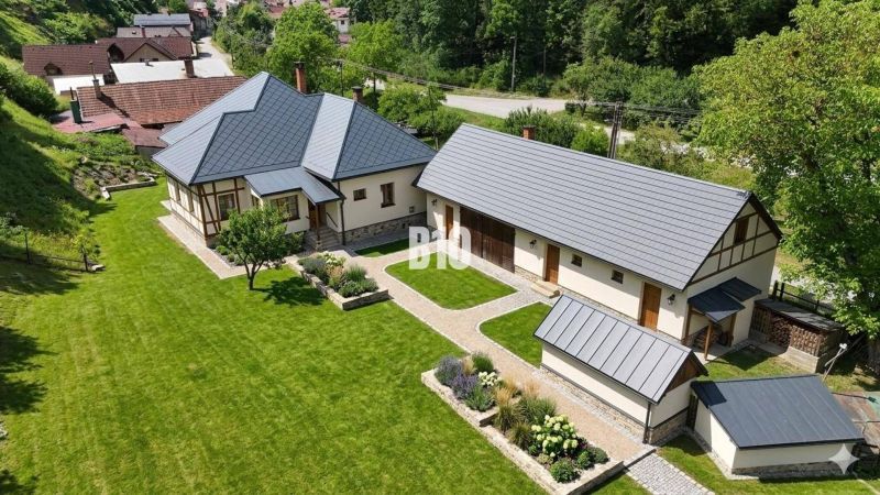 A family house in Belá-Dulice with a large garden and a manicured lawn.