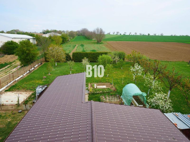 A family house in Lukáčovce with an extensive garden and surrounding fields.
