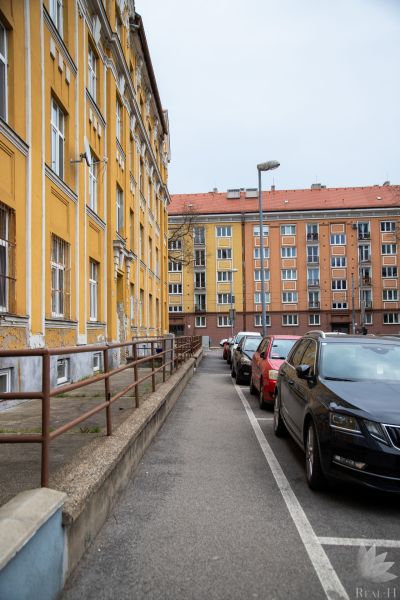 Česká Street in Bratislava - Nové Mesto with historic buildings and parked cars.