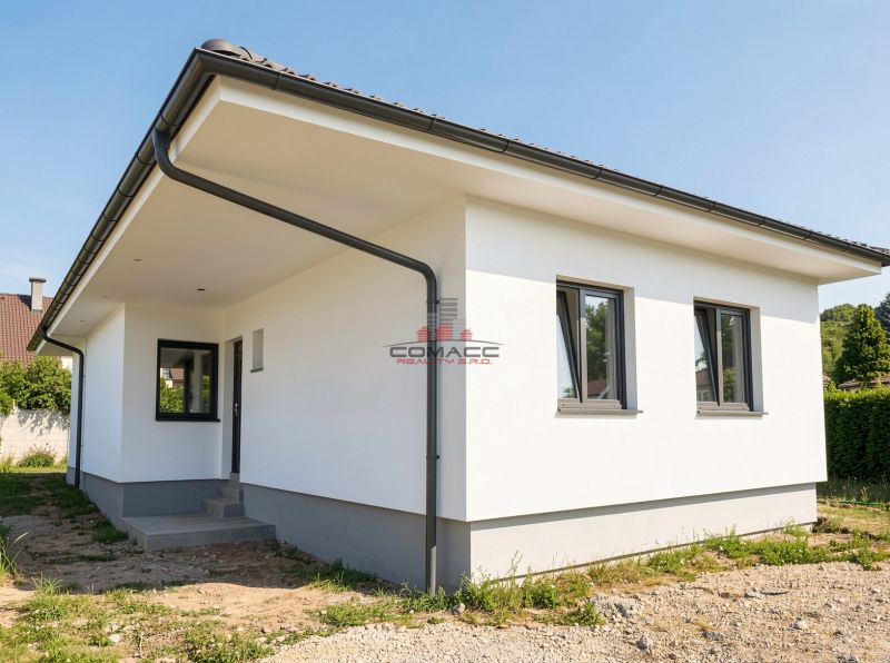 A family house on Pánska Niva in Hlohovec with a white facade and a gray roof.