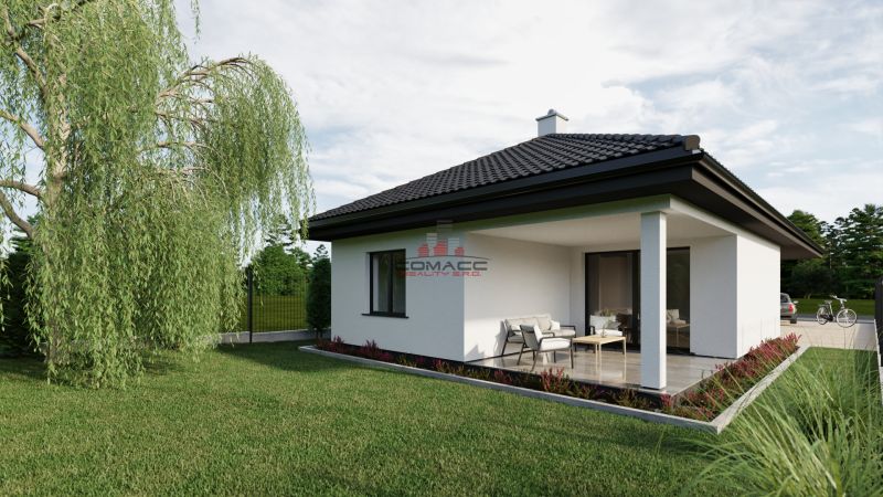 A family house with a terrace on Pánska Niva street, surrounded by green lawn and trees.