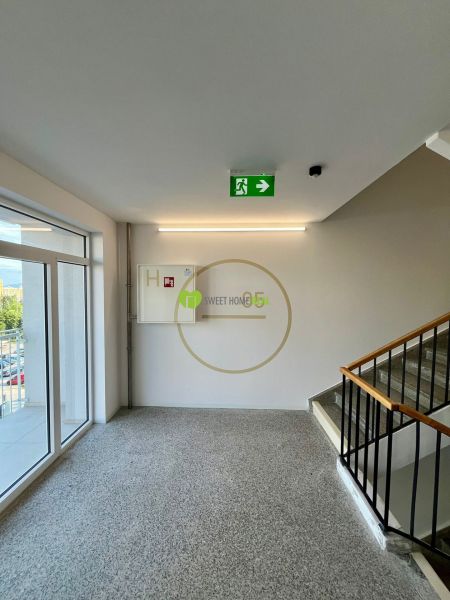 The staircase of a residential building with an emergency exit, view of Košice - Západ district.