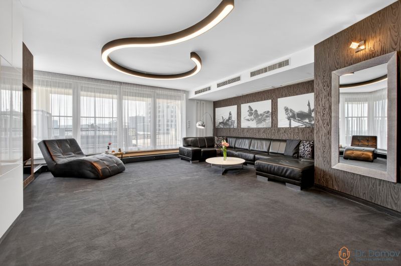 Living room with a sofa set, an armchair, and interesting lighting in a 4-room apartment.