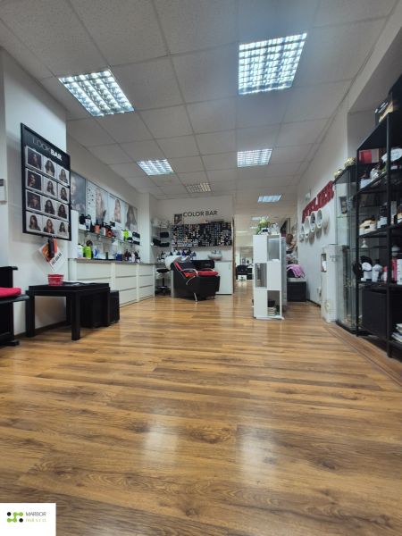 Commercial premises with furnishings and flooring with a wooden decor.