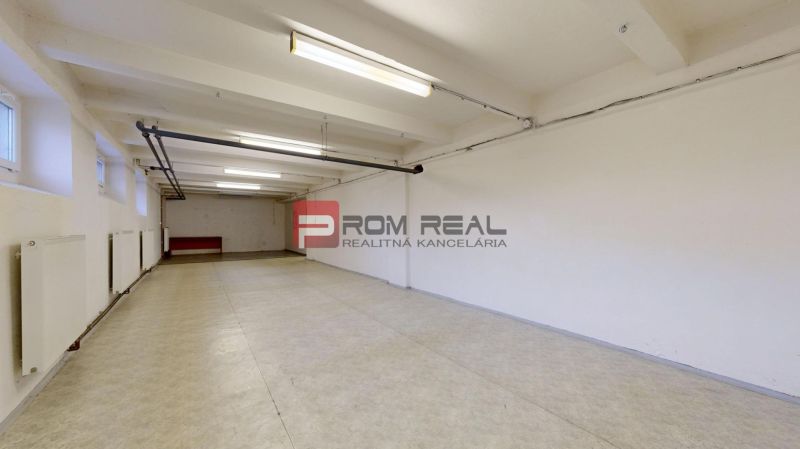 Spacious interior of warehouses and halls with light walls and flooring with wood decor.