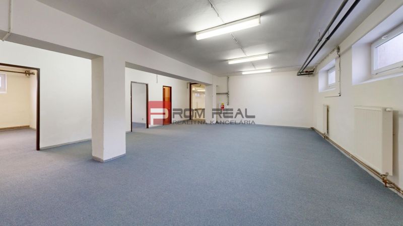 Spacious interior with neutral walls and flooring in warehouses and halls.