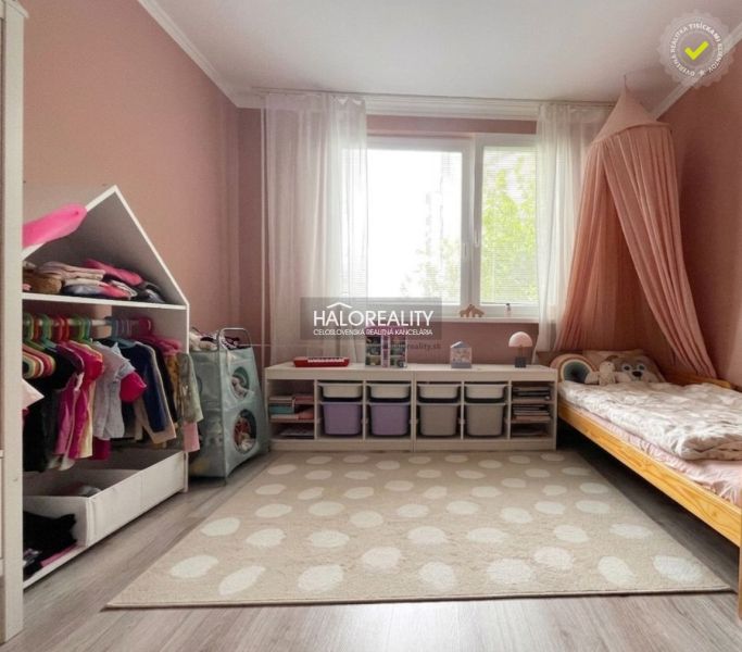 Children's room in a 3-room apartment with a wooden decor floor and storage space.