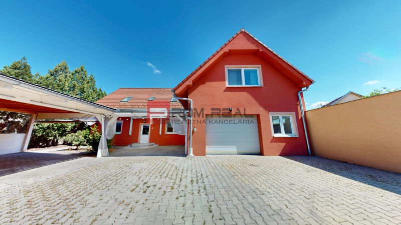 Family house on Gútorská Road in Šamorín with a garage and a paved courtyard.