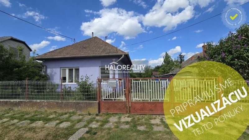 Purple family house in the vicinity of Lok with a fence and gate on a grassy street.