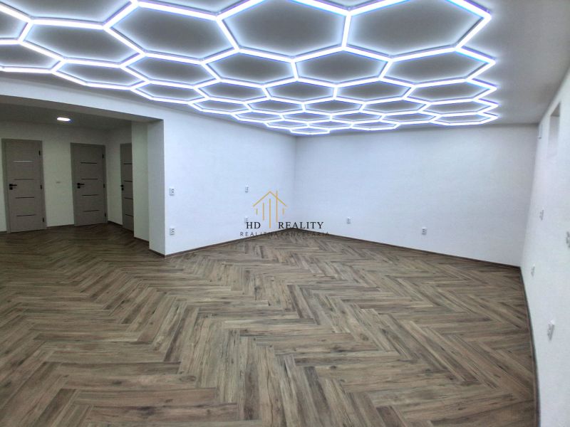 Commercial premises with unique lighting and wooden decor flooring.