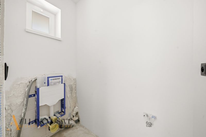 Interior with installed Geberit module in the bathroom of a family house.