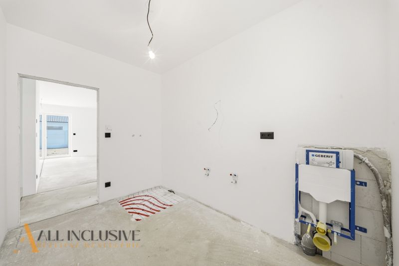 An empty room in a family house prepared for the installation of sanitary equipment.