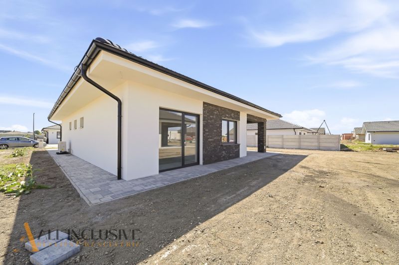 Family house in Hviezdoslavov with a terrace and a paved walkway on the property.