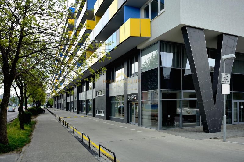 The exterior of the building on Tomášikova Street in Bratislava - Ružinov with colorful balconies.
