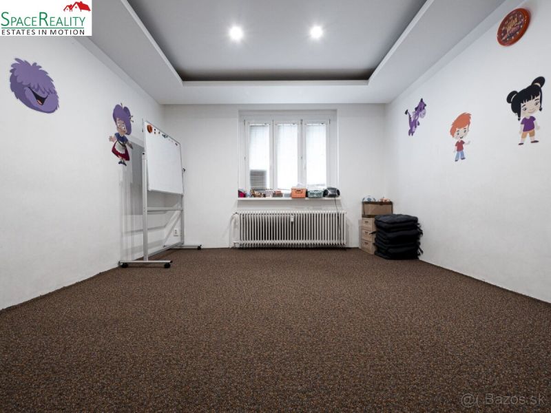 Children's room in a 3-room apartment with decorations and a carpet, a board on wheels.