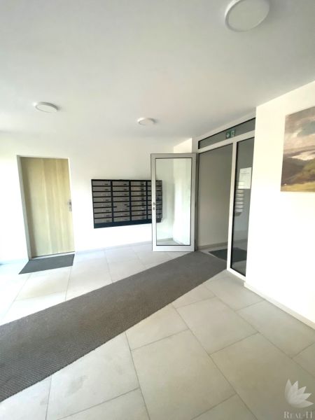 The interior of offices with mailboxes and glass doors.