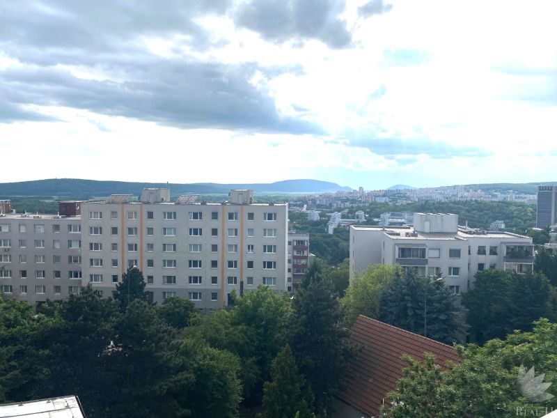 View from Drotárska cesta in Bratislava of residential buildings and nature.