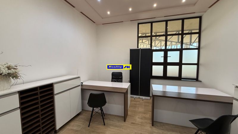 Offices with minimalist furniture and wooden decor flooring.