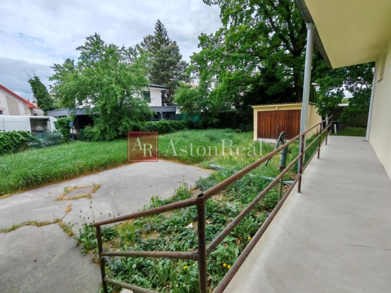 A family house on K Dolnej stanici Street in Trenčín with a spacious garden and greenery.