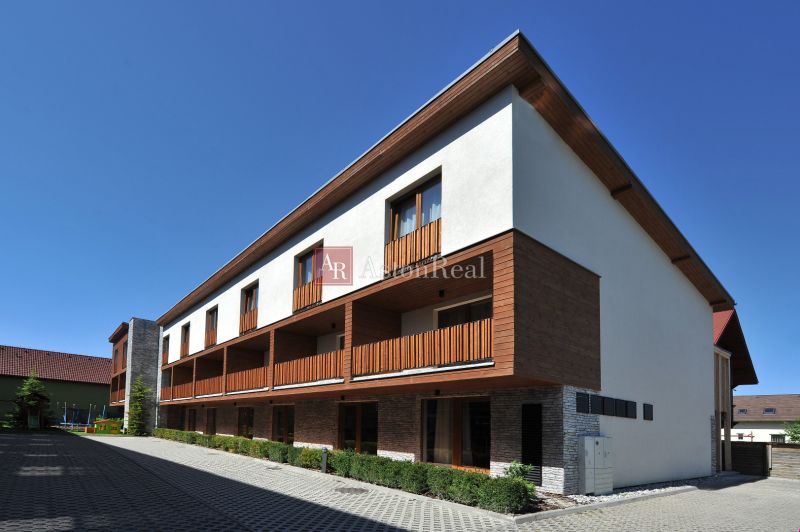 A recreational apartment in Demänová on Demänová Street offers accommodation with a wooden facade decor.
