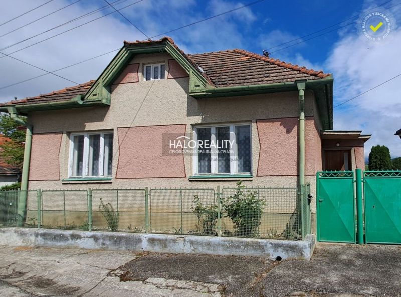 A family house in Veľké Kršteňany with a fence and traditional architecture.