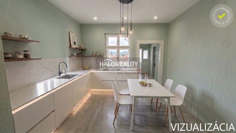 A kitchen in a family house with a dining table and open shelves.