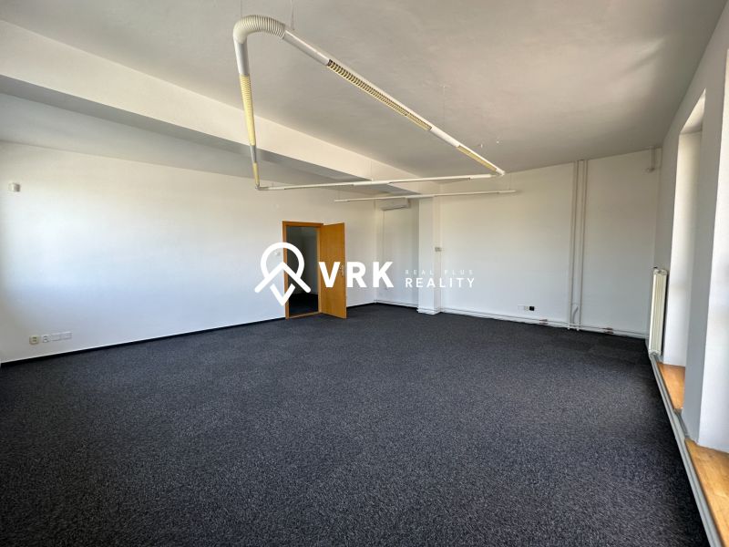 Offices with carpet and lighting.