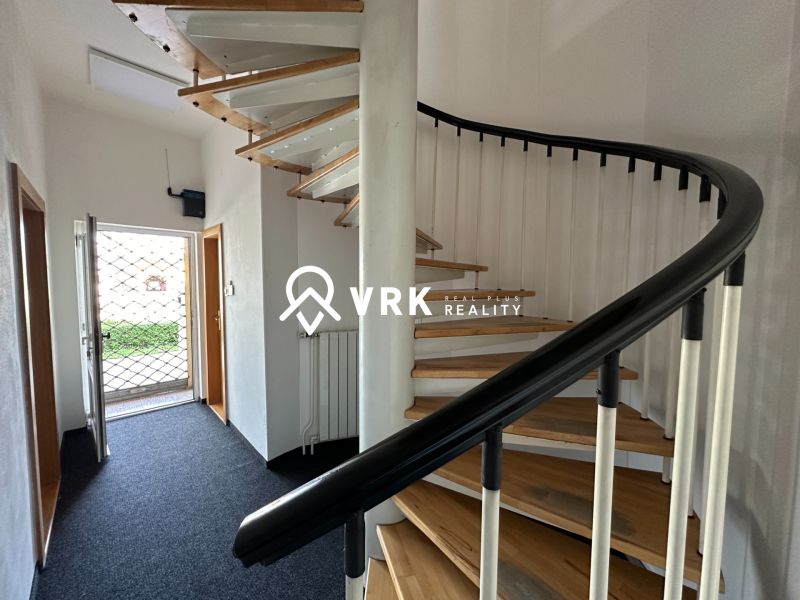 A spiral staircase with a wooden floor decor in offices.