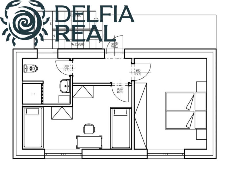 Floor plan of a cottage with a bathroom, toilet, and two separate rooms.
